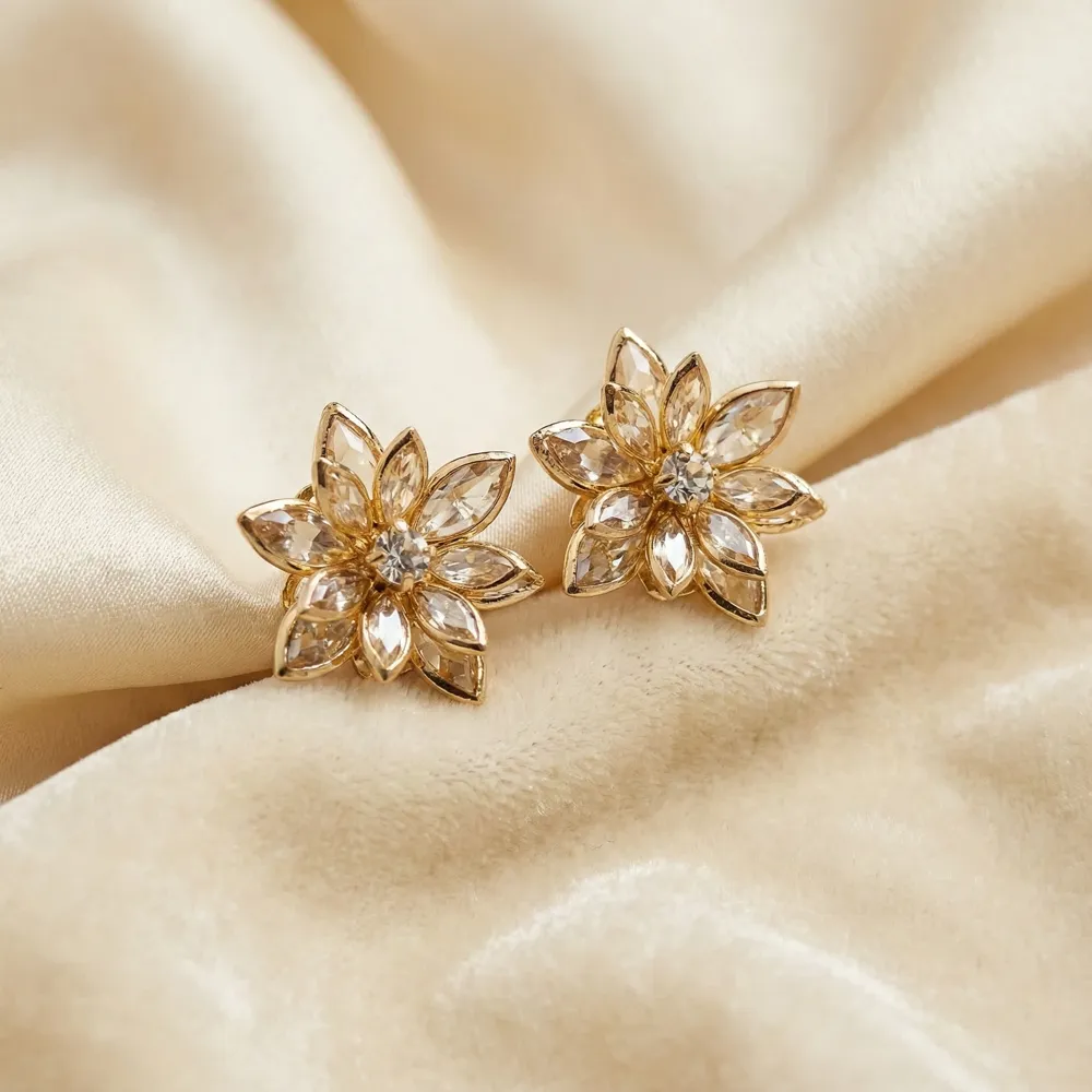 Golden Crystal Blossom Studs Placed on Fabric